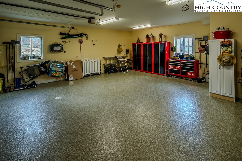909 Daisy Ridge Road Banner Elk, NC 28604 - Photo 44 of 47 a view of a garage with furniture