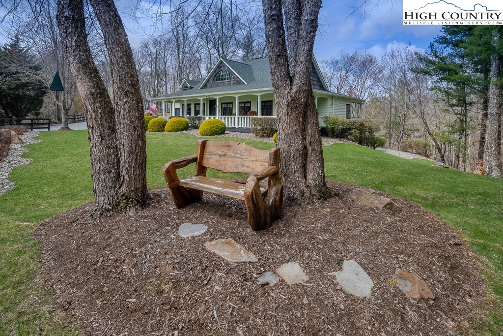 909 Daisy Ridge Road Banner Elk, NC 28604 - Photo 8 of 47 a view of a house with backyard porch and sitting area
