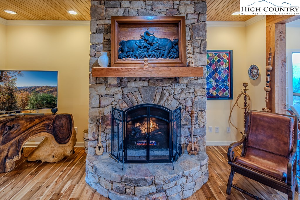 909 Daisy Ridge Road Banner Elk, NC 28604 - Photo 9 of 47 a living room with furniture and a fireplace
