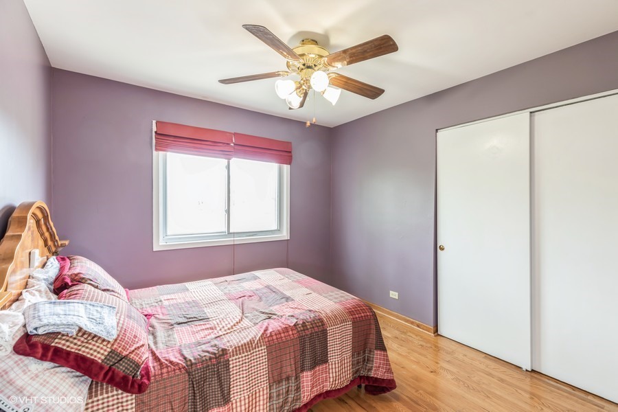 104 Pheasant Road Matteson, IL 60443 - Photo 8 of 19 a bedroom with a bed and a window