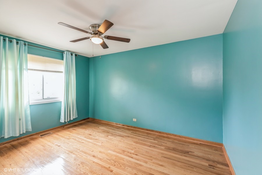 104 Pheasant Road Matteson, IL 60443 - Photo 9 of 19 an empty room with closet and fan