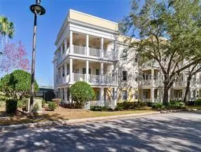 a front view of a building with a yard