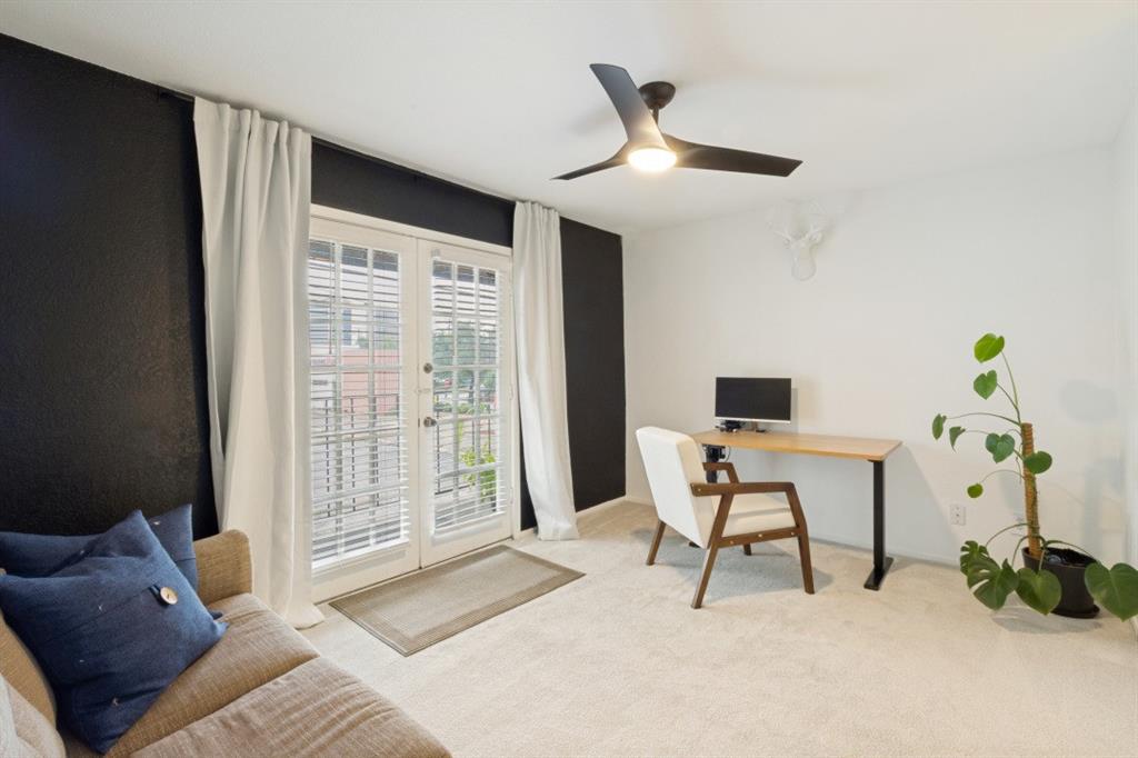 3904 Rawlins Street, Unit 112 Dallas, TX 75219 - Photo 11 of 15 Room featuring carpeted flooring and a contrasting accent wall