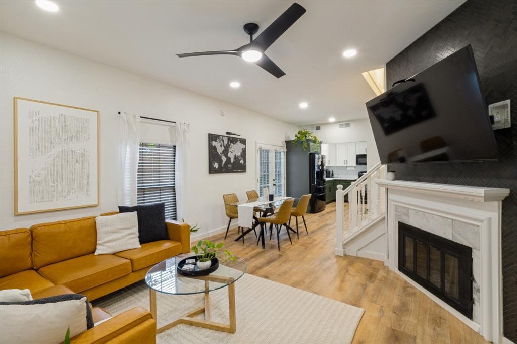 3904 Rawlins Street, Unit 112 Dallas, TX 75219 - Photo 4 of 15 Spacious living area featuring wood-finish flooring, recessed lighting, and a modern ceiling fan