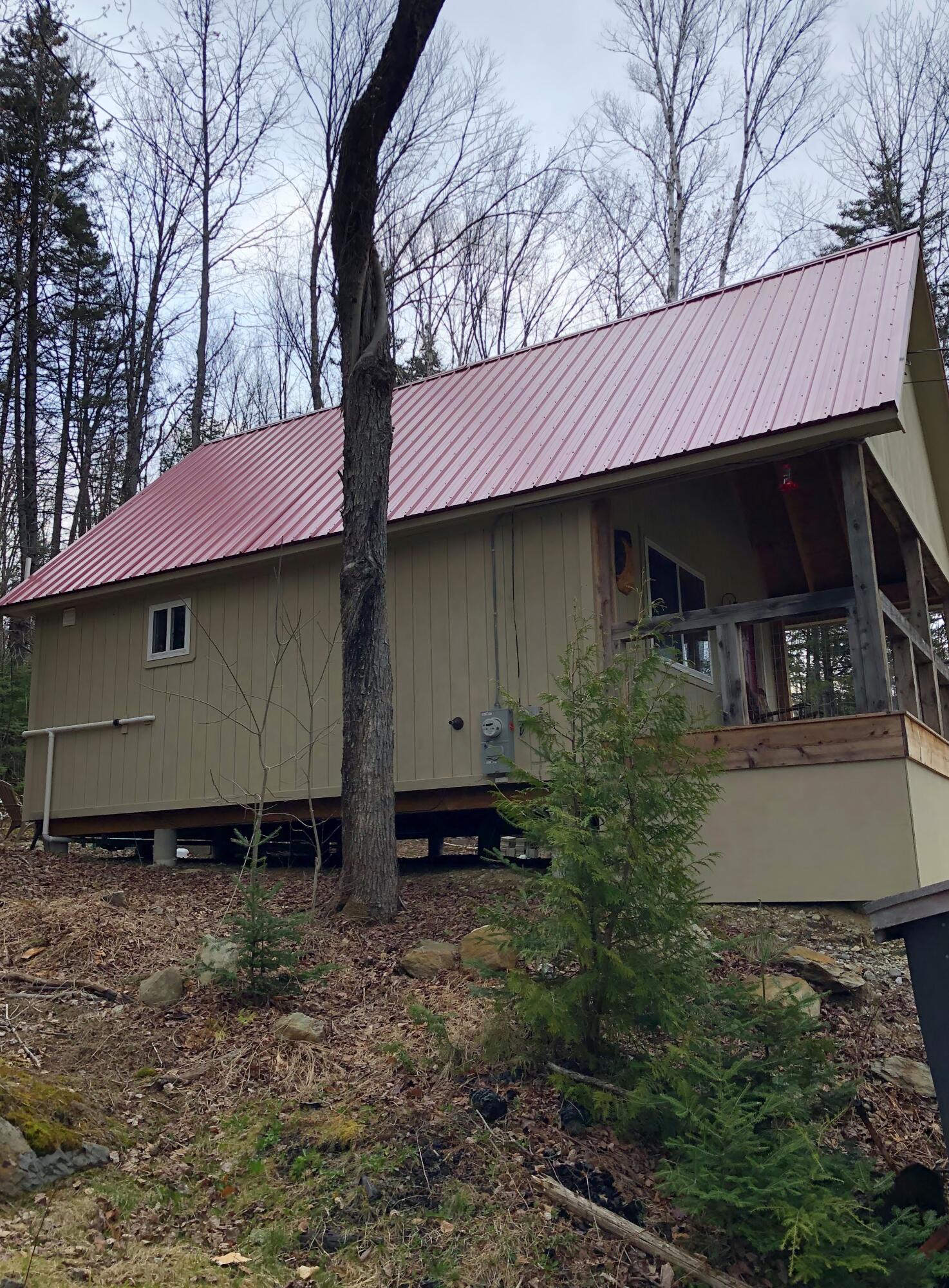 1064 Swift River Road Roxbury, ME 04275 - Photo 10 of 13 Side of camp with front porch