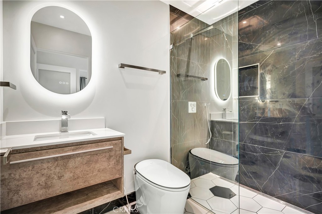 6721 Rhea Reseda, CA 91335 - Photo 15 of 22 a bathroom with a sink a toilet and shower