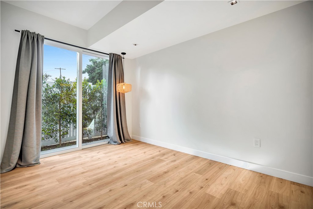 6721 Rhea Reseda, CA 91335 - Photo 19 of 22 wooden floor in an empty room with a window