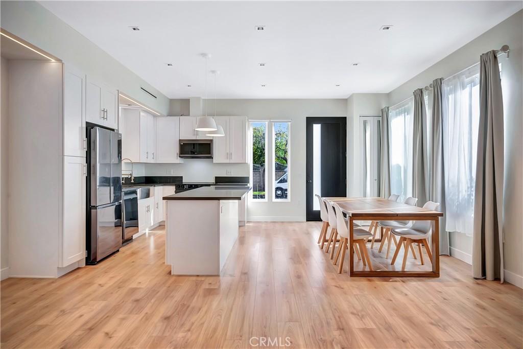 6721 Rhea Reseda, CA 91335 - Photo 6 of 22 a kitchen with stainless steel appliances a refrigerator and a stove top oven