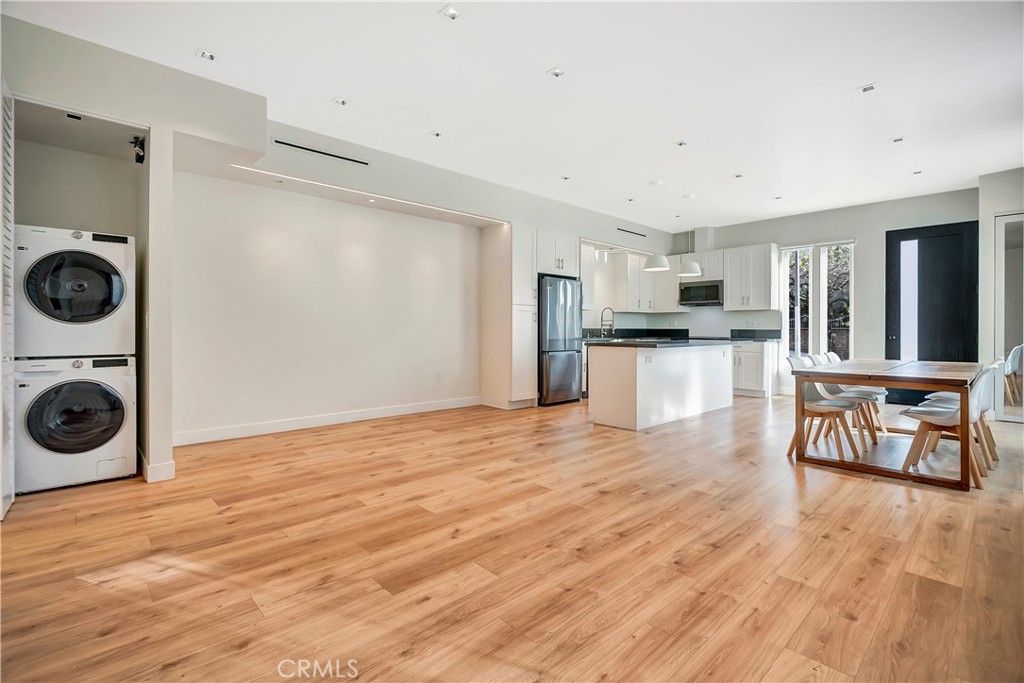 6721 Rhea Reseda, CA 91335 - Photo 8 of 22 a view of a kitchen with a stove wooden cabinets and wooden floor