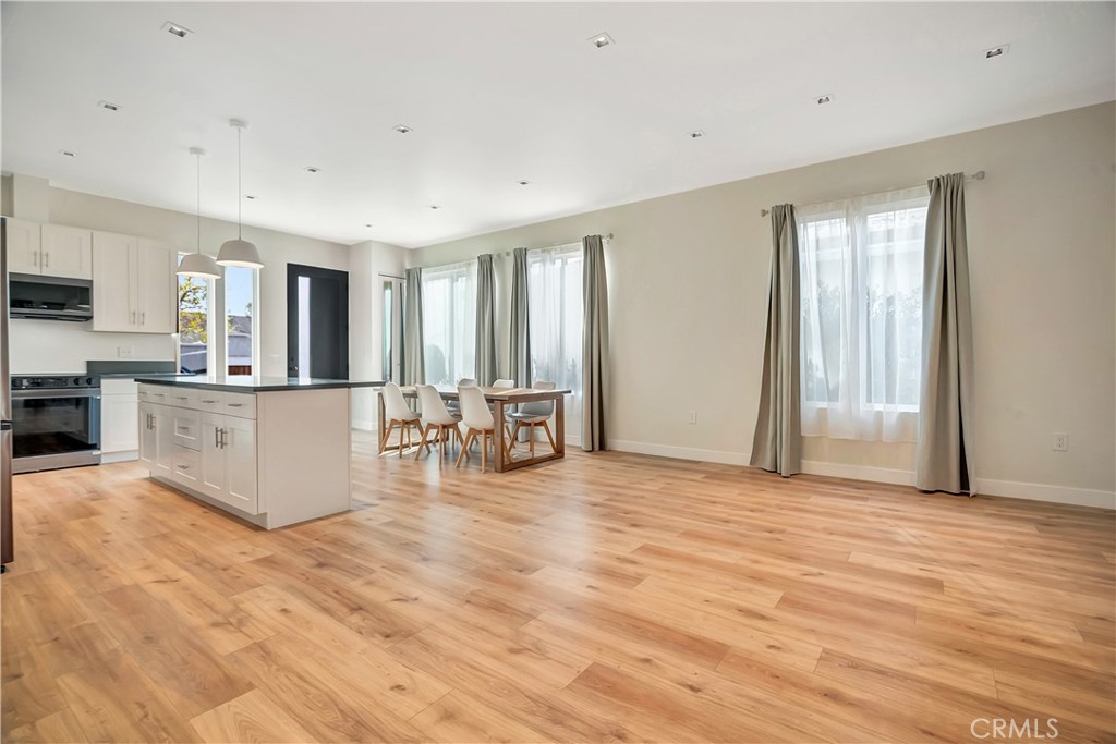 6721 Rhea Reseda, CA 91335 - Photo 10 of 22 a view of a kitchen with furniture and wooden floor