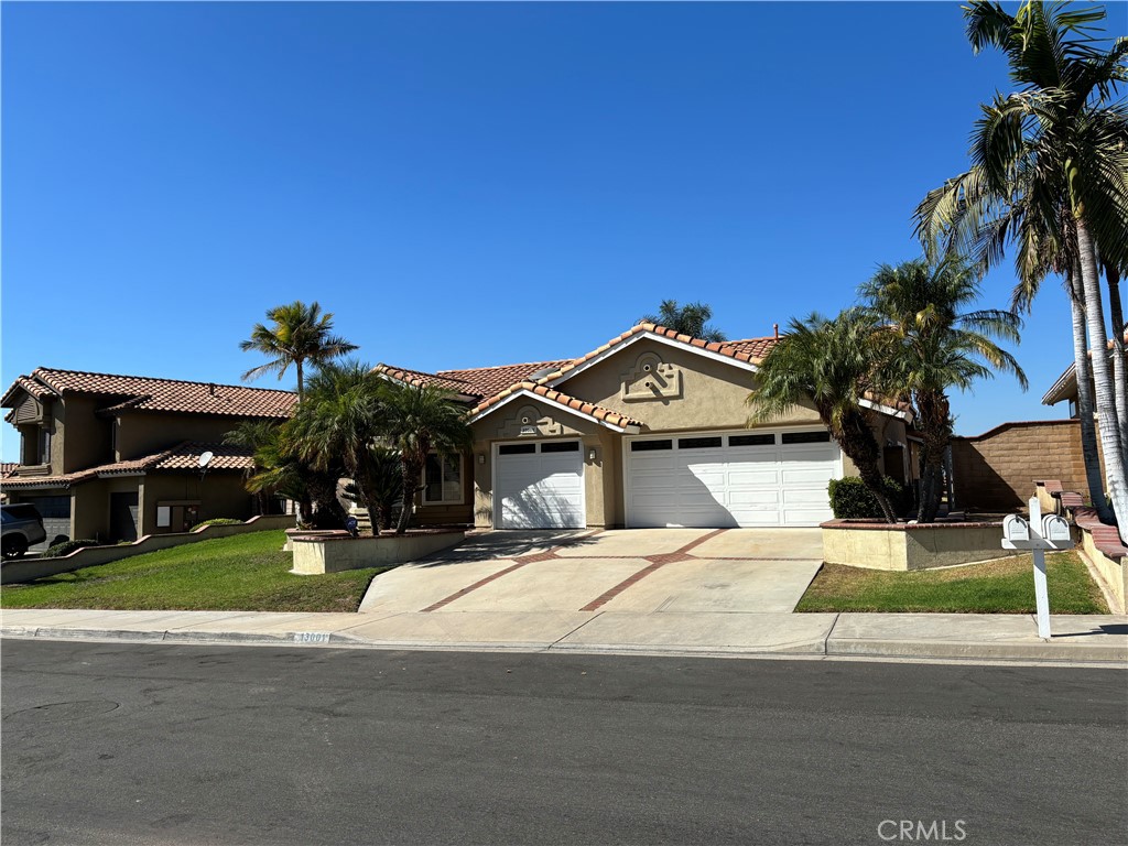 13001 August Circle Riverside, CA 92503 - Photo 2 of 37 a view of a house with a yard and potted plants