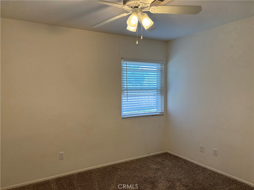 13001 August Circle Riverside, CA 92503 - Photo 25 of 37 an empty room with a window and a fan
