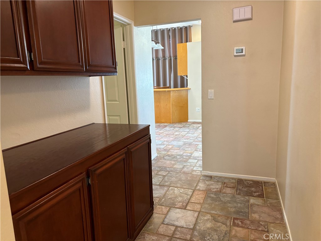13001 August Circle Riverside, CA 92503 - Photo 29 of 37 a view of kitchen with granite countertop cabinets and black appliances