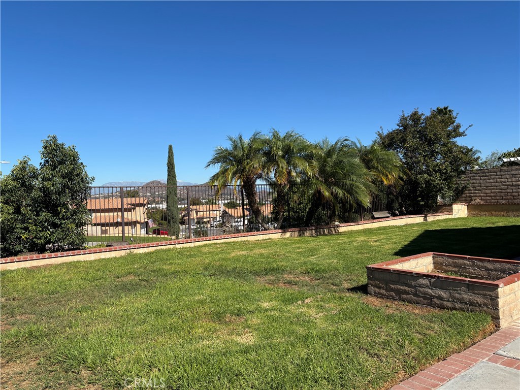 13001 August Circle Riverside, CA 92503 - Photo 4 of 37 a view of a garden with a bench