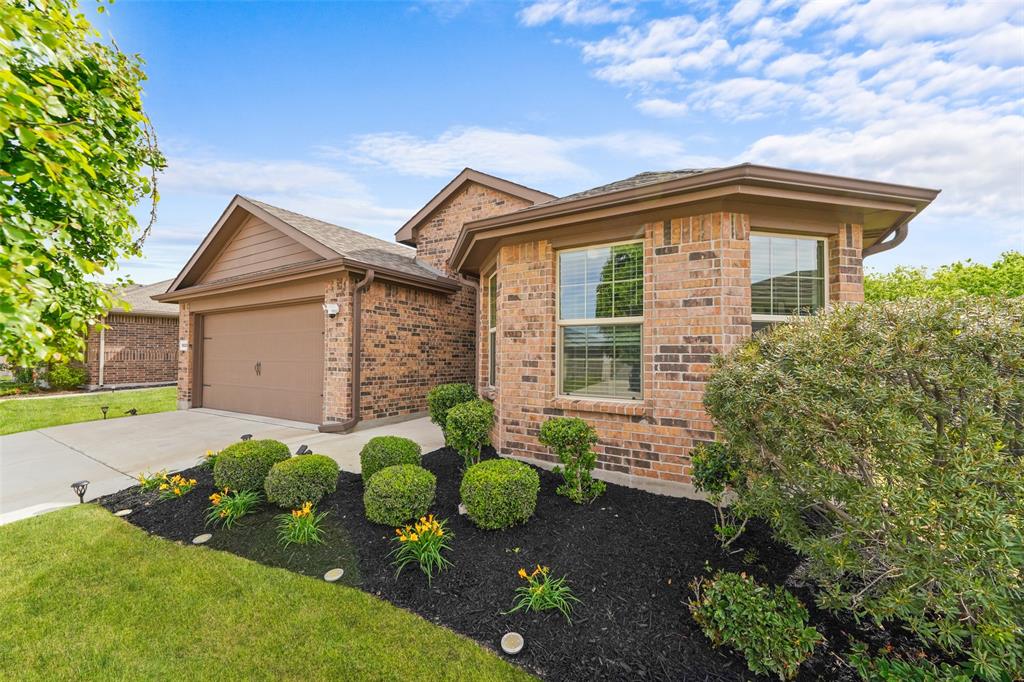 9020 Ridgeriver Way Fort Worth, TX 76131 - Photo 4 of 26 a front view of a house with a yard