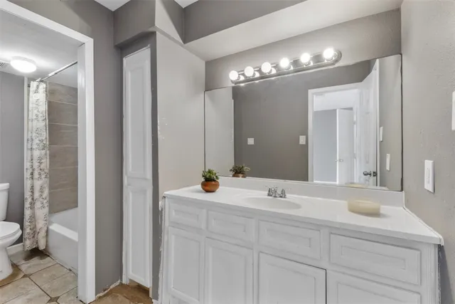 a bathroom with a sink double vanity and a mirror
