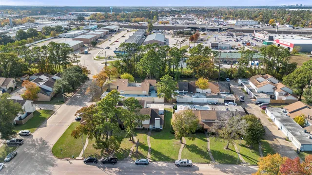 an aerial view of residential houses with outdoor space