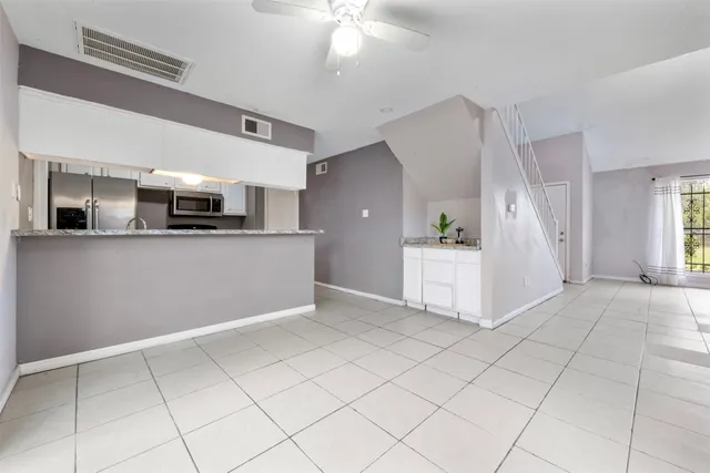 a view of a kitchen with a sink and cabinet with kitchen view