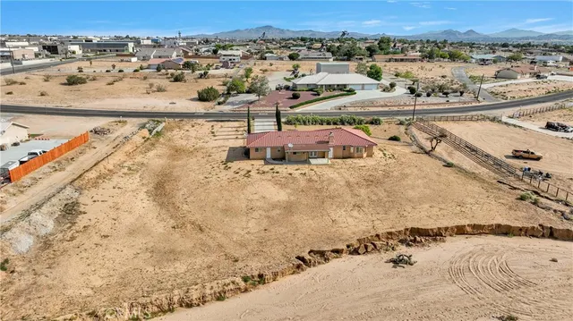 an aerial view of a residential apartment building with a mountain