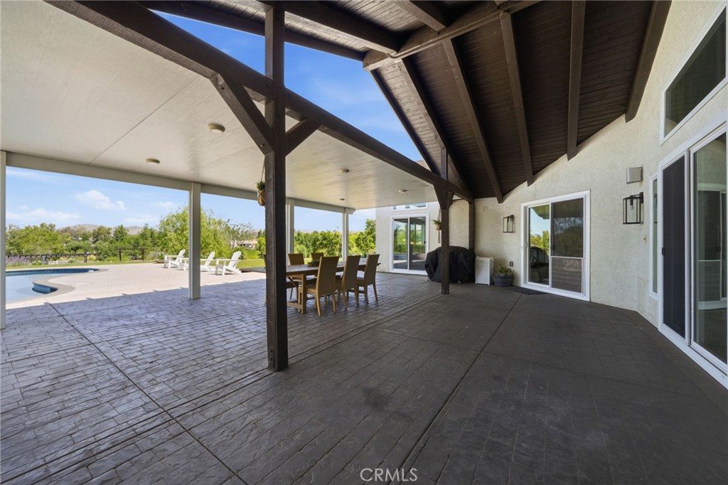 41110 Los Ranchos Circle Temecula, CA 92592 - Photo 52 of 77 a view of outdoor living space with furniture and floor to ceiling window