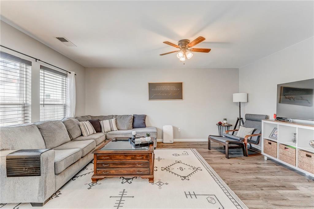 803 Riverside Drive Calhoun, GA 30701 - Photo 22 of 59 a living room with furniture and a flat screen tv
