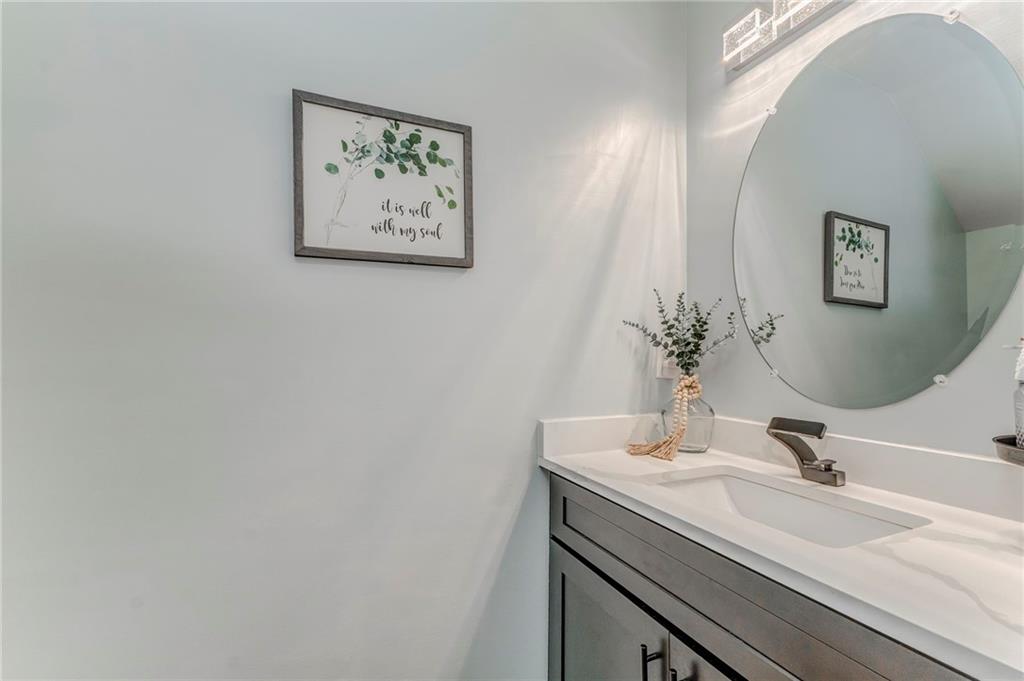 803 Riverside Drive Calhoun, GA 30701 - Photo 25 of 59 a bathroom with a sink and a mirror