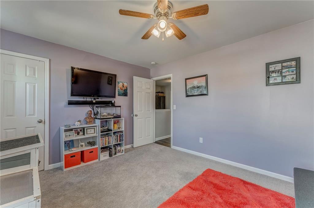 803 Riverside Drive Calhoun, GA 30701 - Photo 37 of 59 a living room with furniture and a flat screen tv
