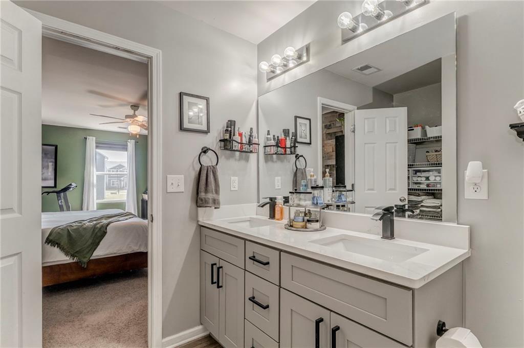 803 Riverside Drive Calhoun, GA 30701 - Photo 46 of 59 a en suite bathroom with double sink and a mirror