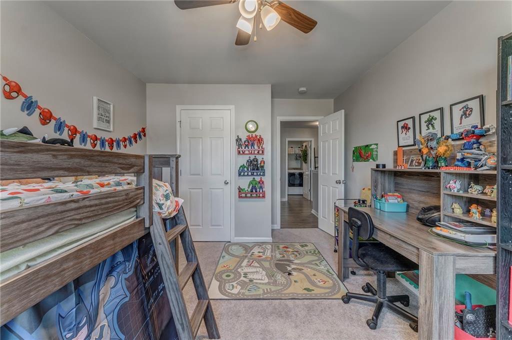 803 Riverside Drive Calhoun, GA 30701 - Photo 48 of 59 a bedroom with furniture and a workspace