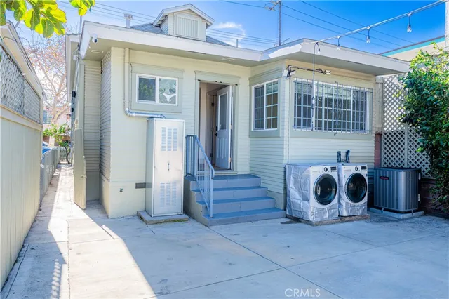 a view of a hallway with washer and dryer