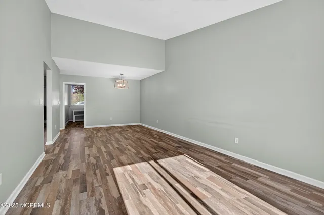 a view of wooden floor in an empty room