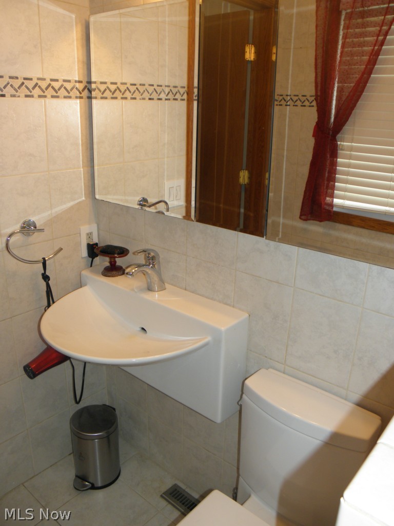 2578 Martin Road Mogadore, OH 44260 - Photo 15 of 25 Master bath updated sink and tiled floors and walls. AWESOME!