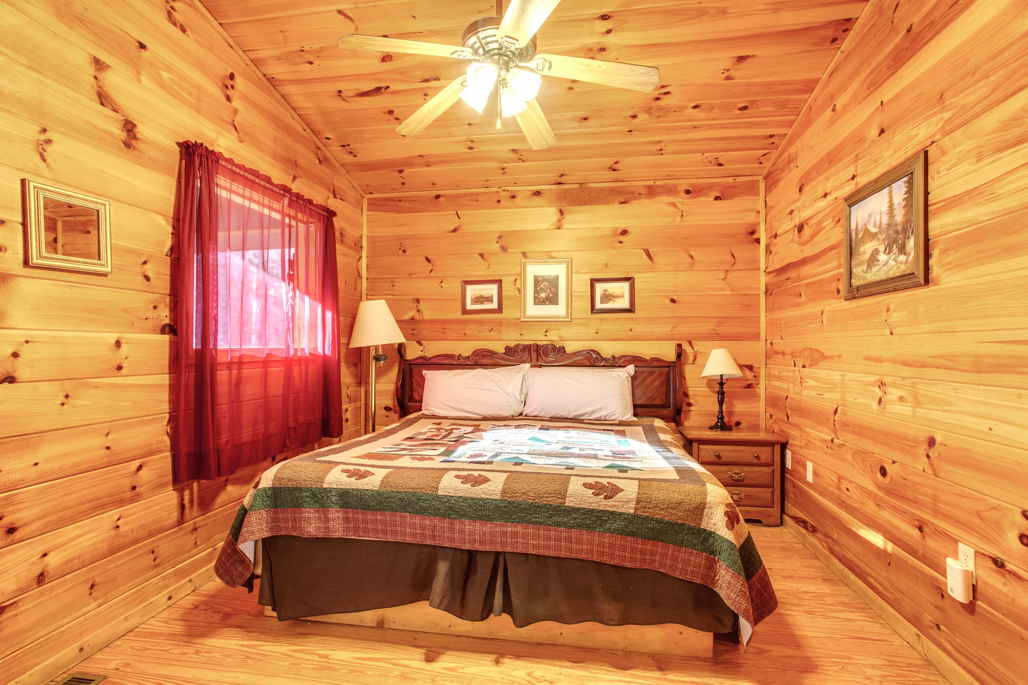 2036 Ridge Road, Unit SUITE 6 Pigeon Forge, TN 37863 - Photo 11 of 29 a bed sitting in a bedroom next to a window