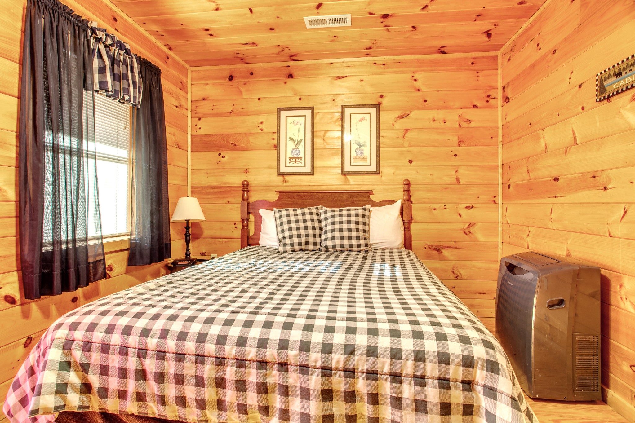 2036 Ridge Road, Unit SUITE 6 Pigeon Forge, TN 37863 - Photo 20 of 29 a bedroom with a bed and wooden floor