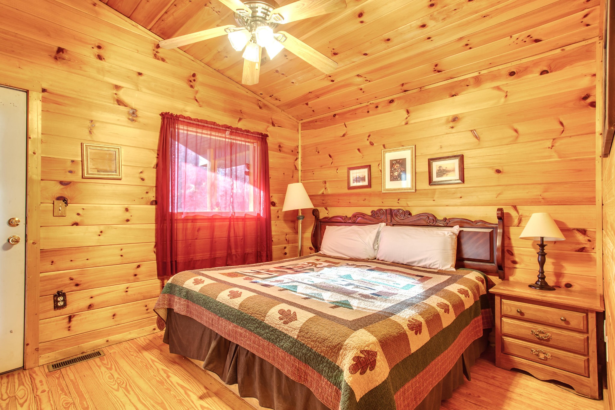2036 Ridge Road, Unit SUITE 6 Pigeon Forge, TN 37863 - Photo 10 of 29 a bedroom with a bed and a night stand
