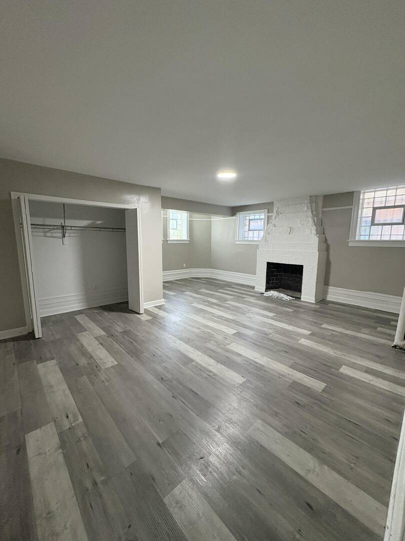 5136 South Blackstone Avenue, Unit 1F Chicago, IL 60615 - Photo 13 of 13 a view of empty room with wooden floor