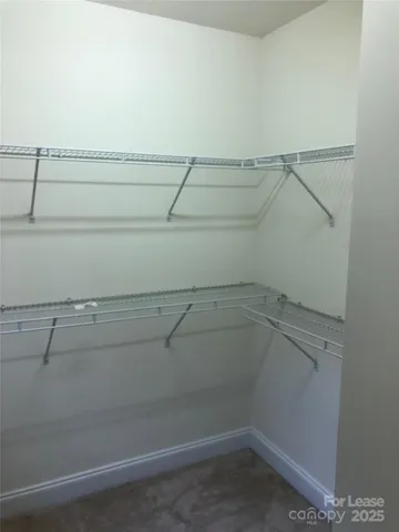 a view of a room with racks on the wall