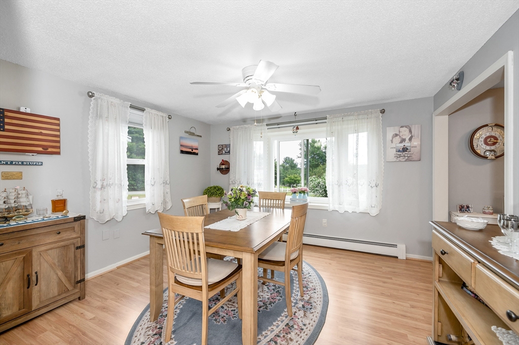 30 Partridge Road Dracut, MA 01826 - Photo 12 of 39 a view of a dining room with furniture window and wooden floor