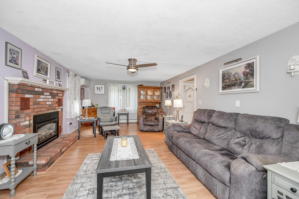 30 Partridge Road Dracut, MA 01826 - Photo 18 of 39 a living room with furniture fireplace and flat screen tv