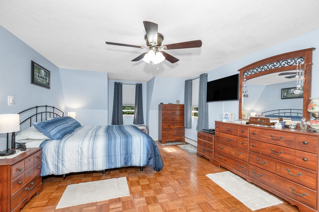 30 Partridge Road Dracut, MA 01826 - Photo 19 of 39 a bedroom with a bed and flat screen tv