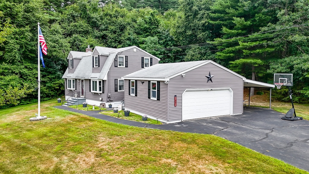 30 Partridge Road Dracut, MA 01826 - Photo 2 of 39 a house view with a backyard space and swimming pool