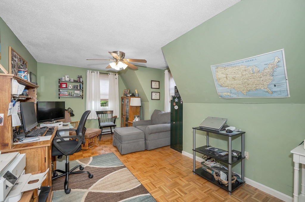 30 Partridge Road Dracut, MA 01826 - Photo 26 of 39 a living room with furniture a flat screen tv and a dining table