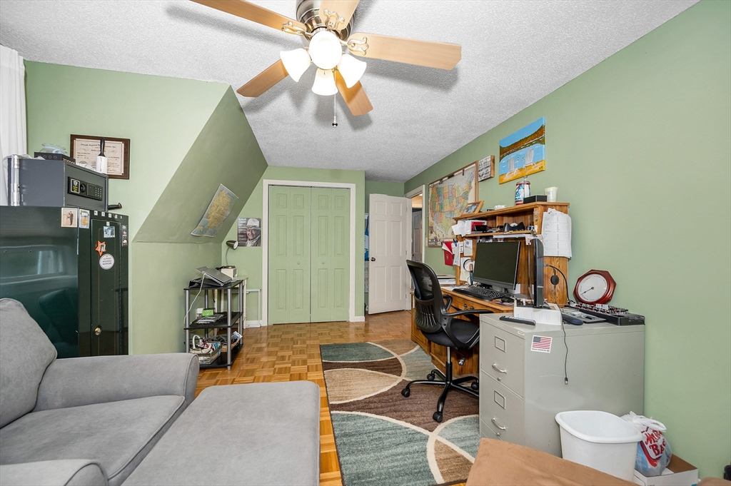 30 Partridge Road Dracut, MA 01826 - Photo 27 of 39 a living room with furniture and a flat screen tv