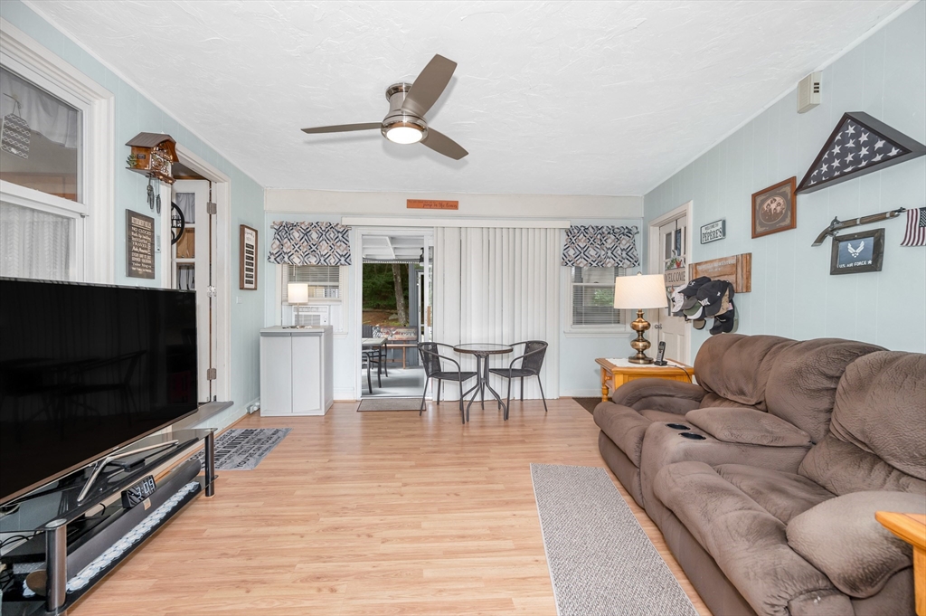 30 Partridge Road Dracut, MA 01826 - Photo 3 of 39 a living room with furniture and a flat screen tv