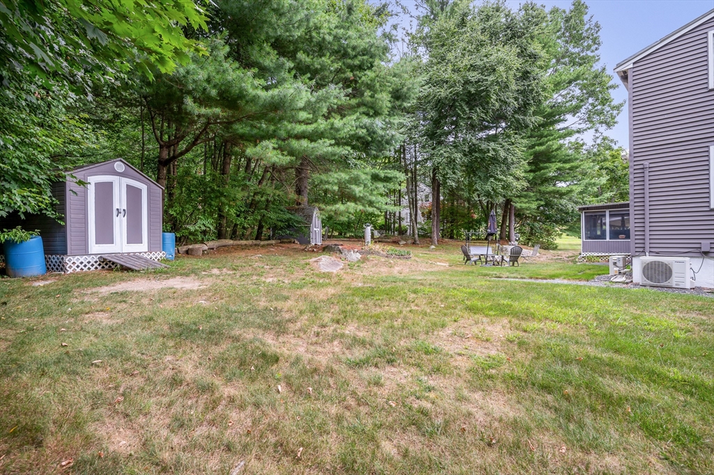 30 Partridge Road Dracut, MA 01826 - Photo 31 of 39 a backyard of a house with lots of green space