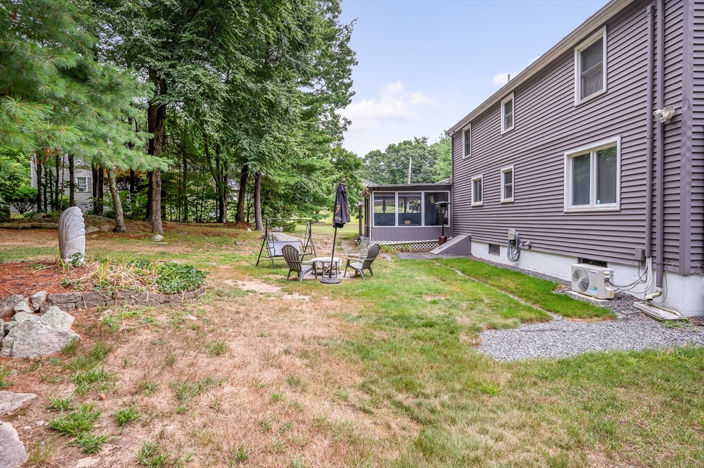 30 Partridge Road Dracut, MA 01826 - Photo 32 of 39 a view of a backyard with a patio