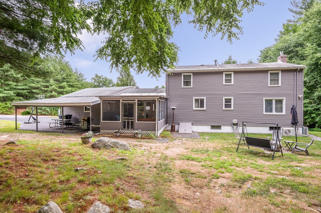 30 Partridge Road Dracut, MA 01826 - Photo 33 of 39 a view of a house with swimming pool and sitting area