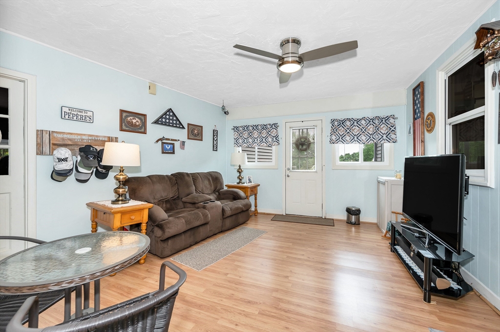 30 Partridge Road Dracut, MA 01826 - Photo 4 of 39 a living room with furniture and a flat screen tv