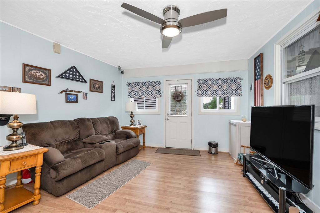 30 Partridge Road Dracut, MA 01826 - Photo 5 of 39 a living room with furniture and a flat screen tv