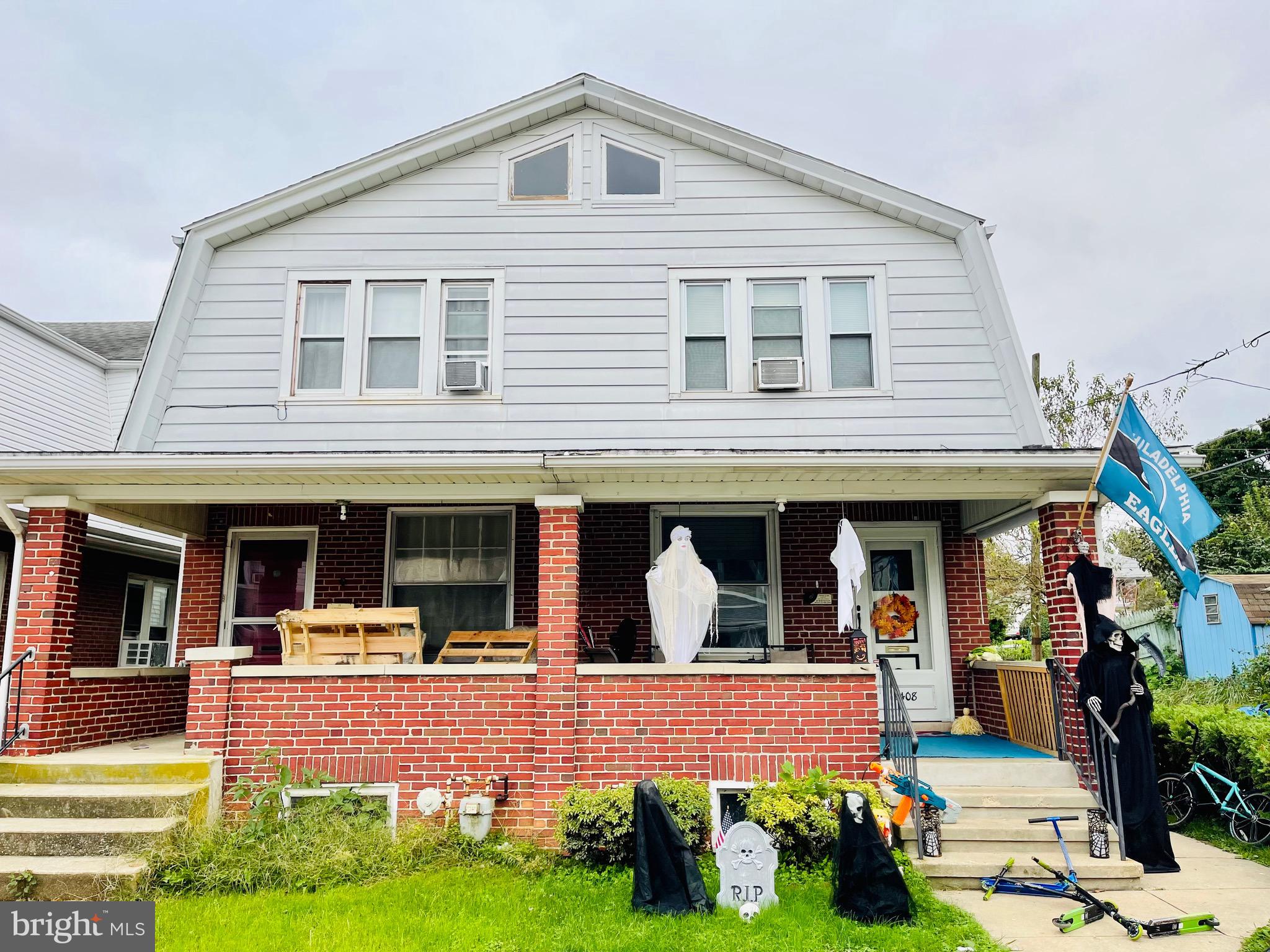 2408 Noble Street Reading, PA 19609 - Photo 2 of 31 a front view of a house with garden